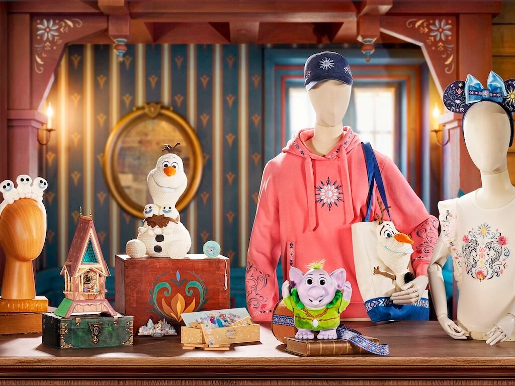 World of Frozen merchandise featuring Olaf plush, Arendelle themed clothing and accessories.